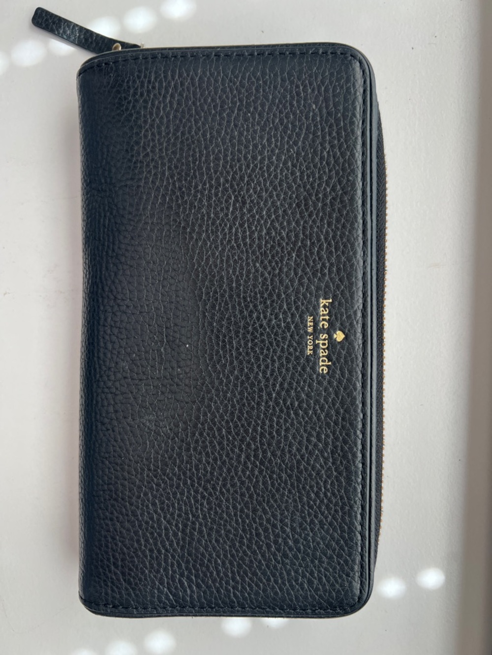 kate spade black pebbled leather zip clutch with gold logo